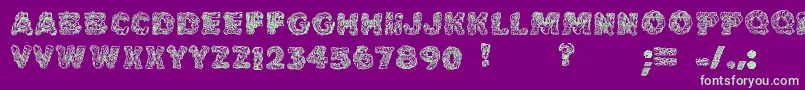 Cakefrostingdecorative-Schriftart – Grüne Schriften auf violettem Hintergrund