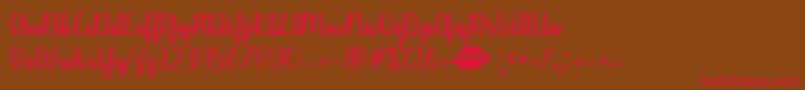 KissMeOrNotTtf Font – Red Fonts on Brown Background