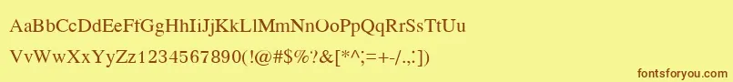 フォントKodchiangupc – 茶色の文字が黄色の背景にあります。