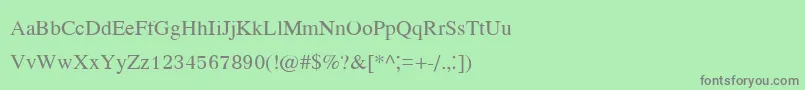 フォントKodchiangupc – 緑の背景に灰色の文字