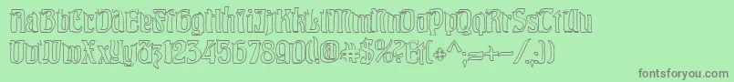 PittoreskHollow-fontti – harmaat kirjasimet vihreällä taustalla