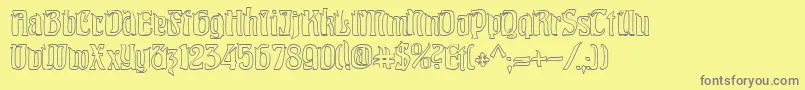 PittoreskHollow-fontti – harmaat kirjasimet keltaisella taustalla