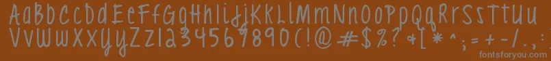 Czcionka Kgloveyouthroughit3 – szare czcionki na brązowym tle
