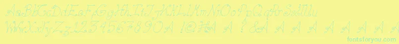 フォントElizabethCursiva – 黄色い背景に緑の文字