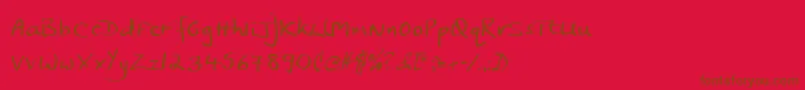 フォントJphst – 赤い背景に茶色の文字