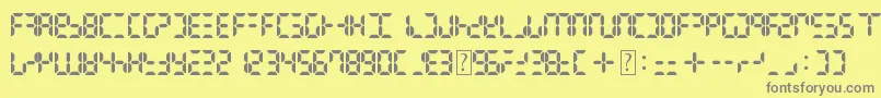Czcionka DigitalDismay – szare czcionki na żółtym tle