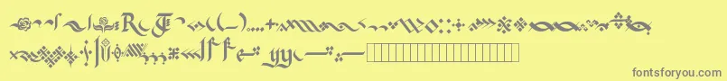 フォントKingthingsFlourishes – 黄色の背景に灰色の文字