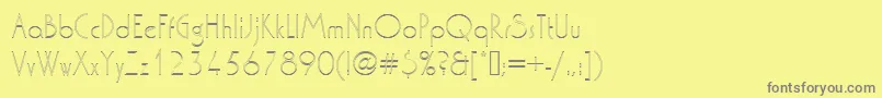 Washingtondextligou1-fontti – harmaat kirjasimet keltaisella taustalla