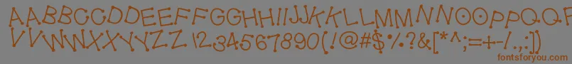フォントGeldoticajumpyf – 茶色の文字が灰色の背景にあります。