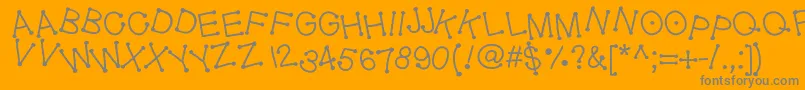 Geldoticajumpyf-fontti – harmaat kirjasimet oranssilla taustalla