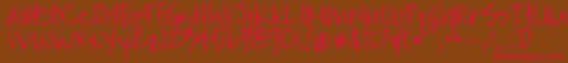 フォントJayneprintyoff – 赤い文字が茶色の背景にあります。