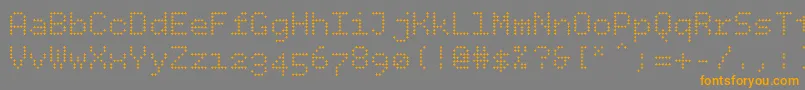 フォントBpdotsplus – オレンジの文字は灰色の背景にあります。