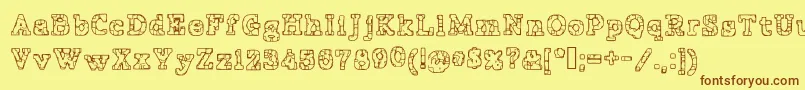 PrisonTattoo Font – Brown Fonts on Yellow Background