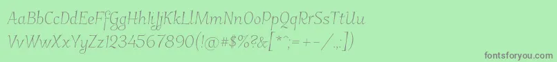 フォントGarineldo – 緑の背景に灰色の文字