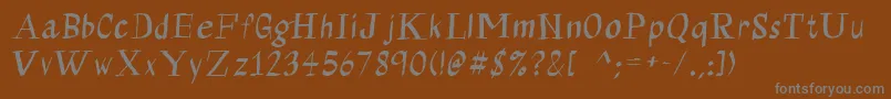Fonte Calligraserif – fontes cinzas em um fundo marrom