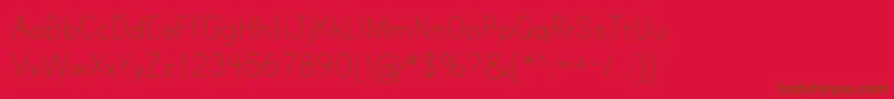 フォントPrintClearlyOt – 赤い背景に茶色の文字