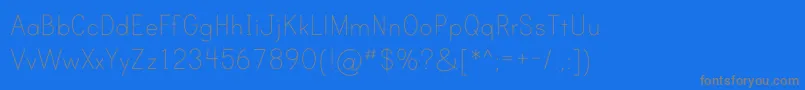 PrintClearlyOt-fontti – harmaat kirjasimet sinisellä taustalla