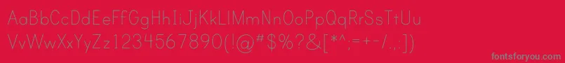 フォントPrintClearlyOt – 赤い背景に灰色の文字