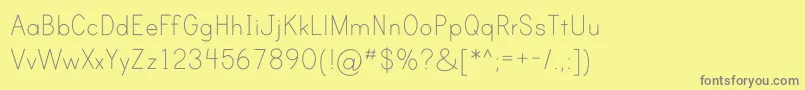 フォントPrintClearlyOt – 黄色の背景に灰色の文字