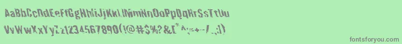 Quarrystoneleft-Schriftart – Graue Schriften auf grünem Hintergrund