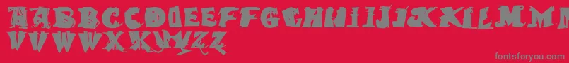 フォントQuasimodocaps – 赤い背景に灰色の文字