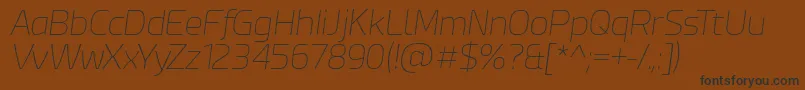 フォントEsphimereThinItalic – 黒い文字が茶色の背景にあります