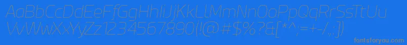 EsphimereThinItalic-Schriftart – Graue Schriften auf blauem Hintergrund