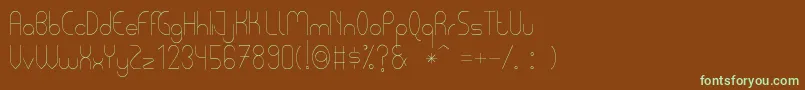 フォントPycuafLightTfb – 緑色の文字が茶色の背景にあります。