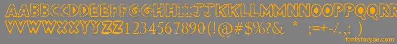 フォントPunkedOut – オレンジの文字は灰色の背景にあります。