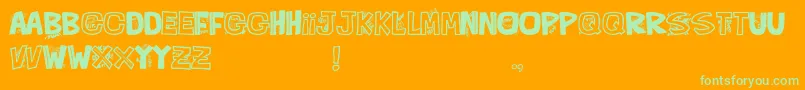 QueFontita21-Schriftart – Grüne Schriften auf orangefarbenem Hintergrund