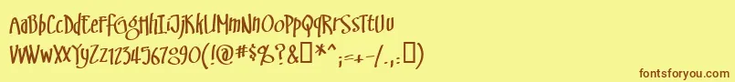 フォントSwinsbrg – 茶色の文字が黄色の背景にあります。