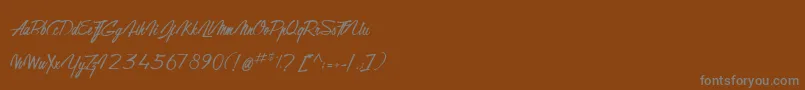 GentlemanOnTheRainbow Font – Gray Fonts on Brown Background