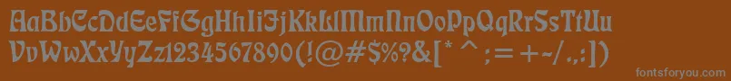 Freeform710Bt-Schriftart – Graue Schriften auf braunem Hintergrund