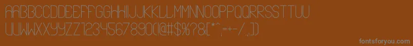 フォントAblax – 茶色の背景に灰色の文字