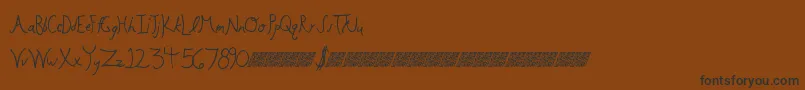 フォントFloweringbuds – 黒い文字が茶色の背景にあります