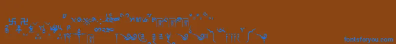 フォントTibetanmachineweb8 – 茶色の背景に青い文字