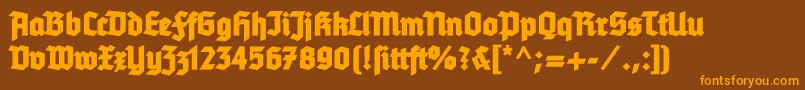 Tannenbergfett-Schriftart – Orangefarbene Schriften auf braunem Hintergrund