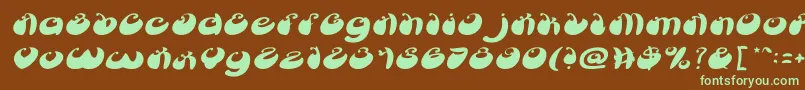 フォントButterflyItalic – 緑色の文字が茶色の背景にあります。