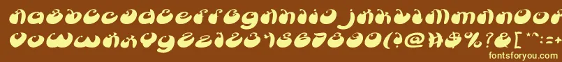 ButterflyItalic-fontti – keltaiset fontit ruskealla taustalla