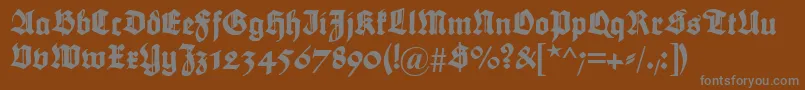 Maximilian Font – Gray Fonts on Brown Background