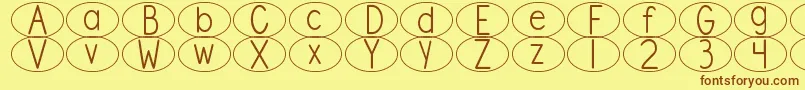 DjbStandardizedTestOval Font – Brown Fonts on Yellow Background