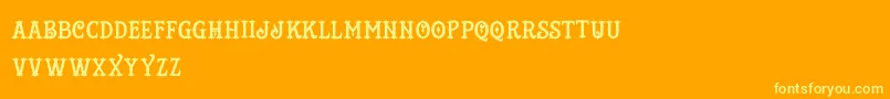 Шрифт TattooShop – жёлтые шрифты на оранжевом фоне