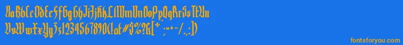 フォントYerninde – オレンジ色の文字が青い背景にあります。