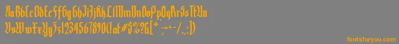 フォントYerninde – オレンジの文字は灰色の背景にあります。