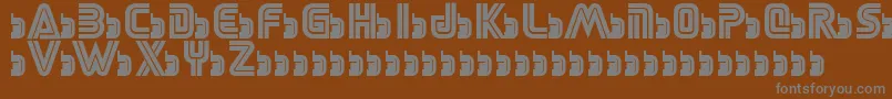 SegaLogoFont-fontti – harmaat kirjasimet ruskealla taustalla