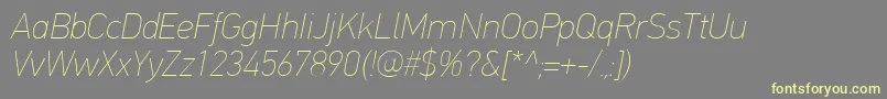 Fonte PfdintextproExtrathinitalic – fontes amarelas em um fundo cinza