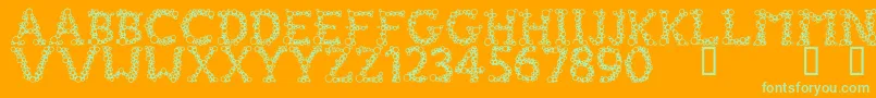 FizzoMedium-Schriftart – Grüne Schriften auf orangefarbenem Hintergrund