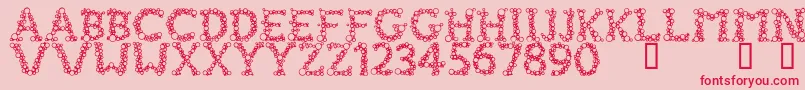 FizzoMedium-Schriftart – Rote Schriften auf rosa Hintergrund