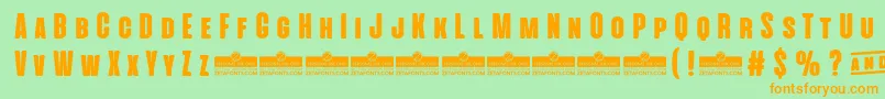 AlienscowsHeavyTrial Font – Orange Fonts on Green Background