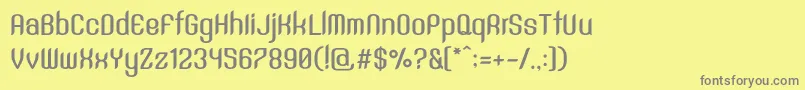 SntAnouvongBoldRegular-fontti – harmaat kirjasimet keltaisella taustalla